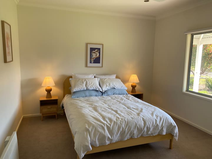 Second bedroom with queen bed and mountain views 