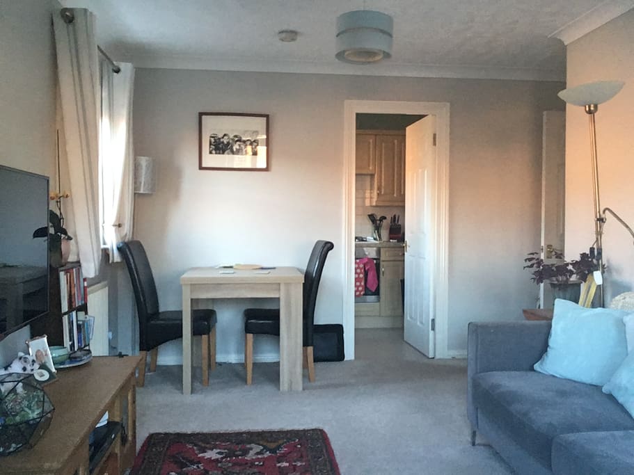 Living room looking into separate kitchen