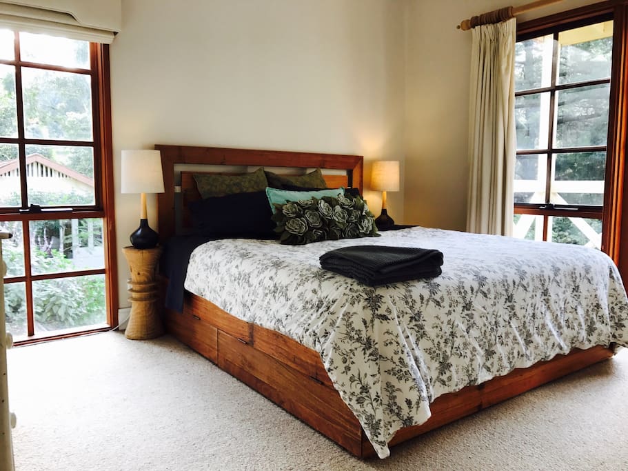 The main bedroom with king bed and private balcony