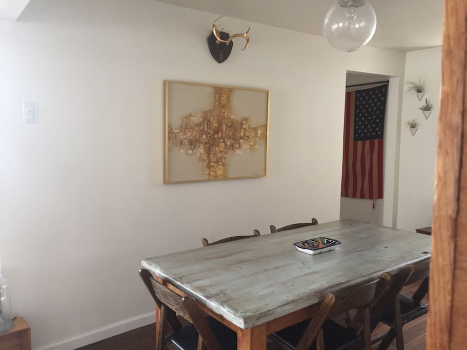 Large vintage dining table with 6 chairs! Mid century painting and globe light