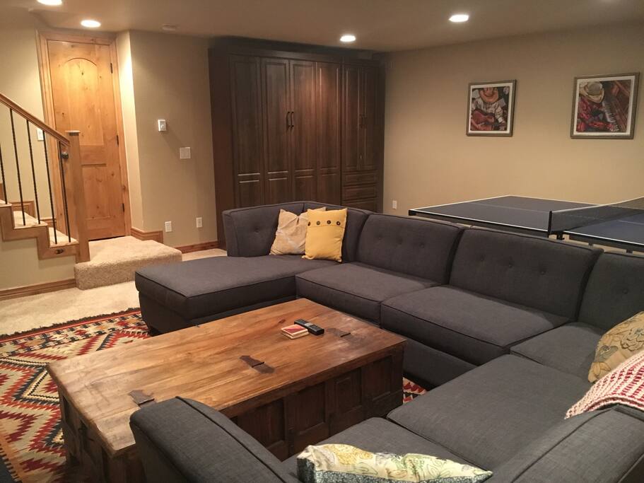 Family room/basement (notice custom built murphy bed built into wall). Queen bed with great mattress and closet space