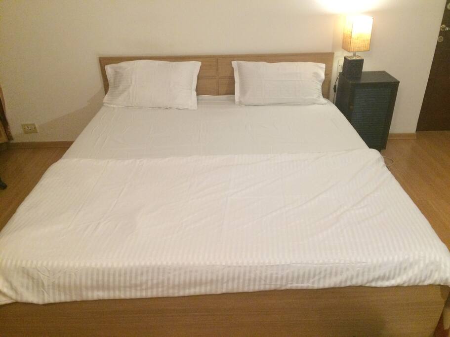Queen sized bed with comforter