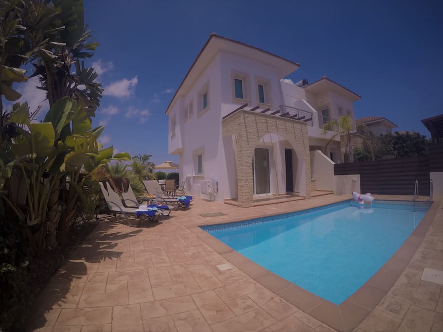 lovely pool area with mature gardens.
