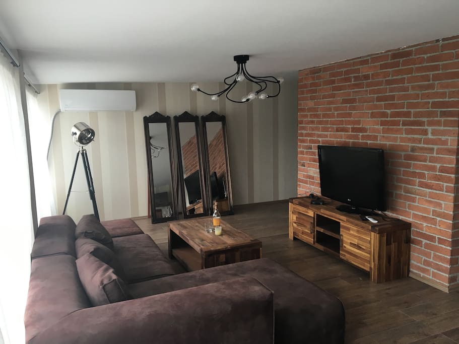 Comfortable sitting room with TV and air conditioner