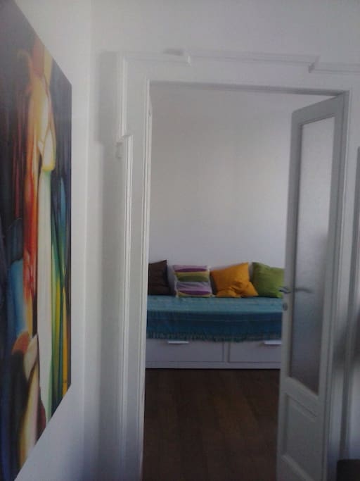 The room is beside the living room