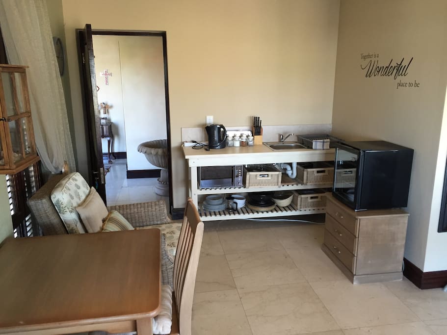 Kitchen net with all necessary cutlery and crockery with all cooking utensils. Microwave oven, kettle, fridge
