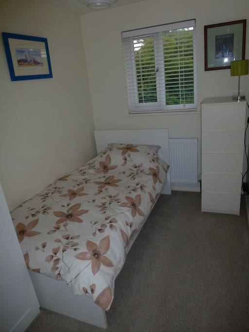 Comfortable bed and plenty of wardrobe and drawer space.