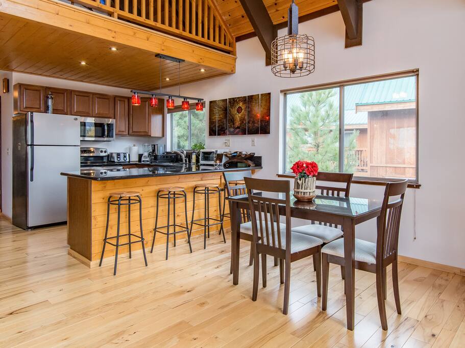 Enjoy meals at the 4-seat dining table or belly up to 4 seats at the kitchen bar.