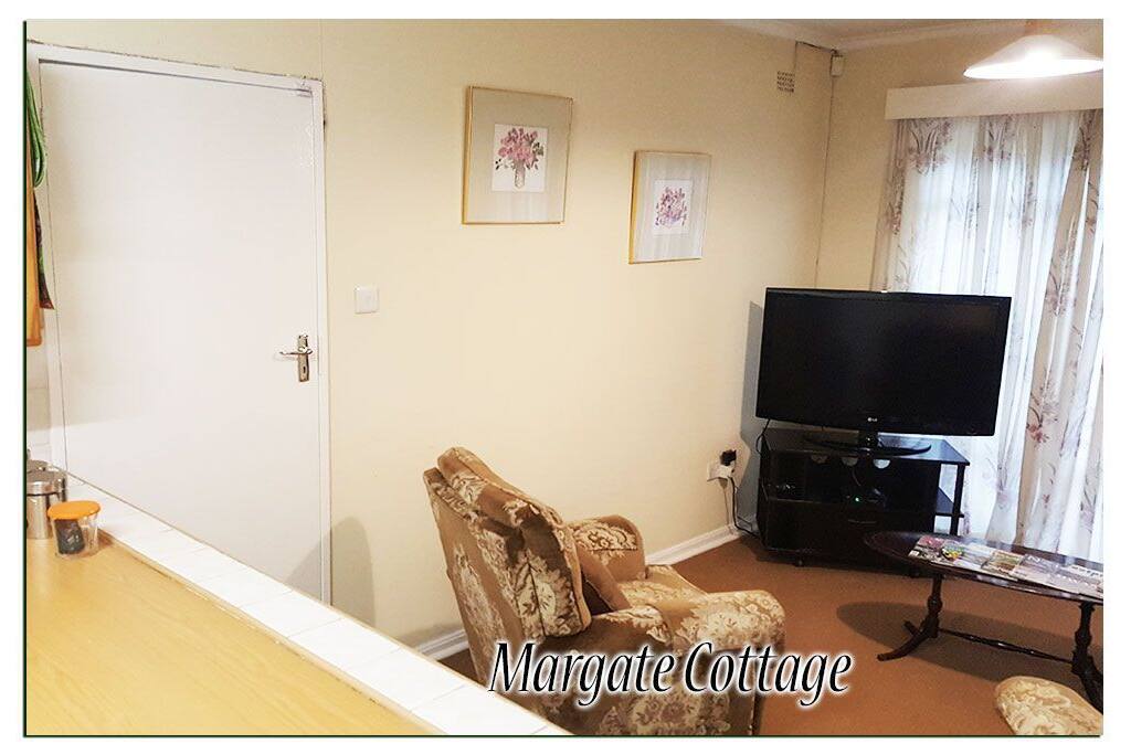 Comfortable well appointed lounge that features:
* A 42 inch LCD television
* A decoder with DSTV cable channels.
*Two comfortable armchairs