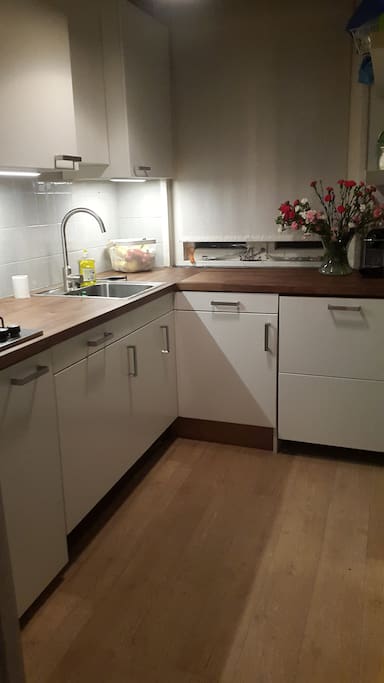 The kitchen, has a dishwasher and combi microwave/oven