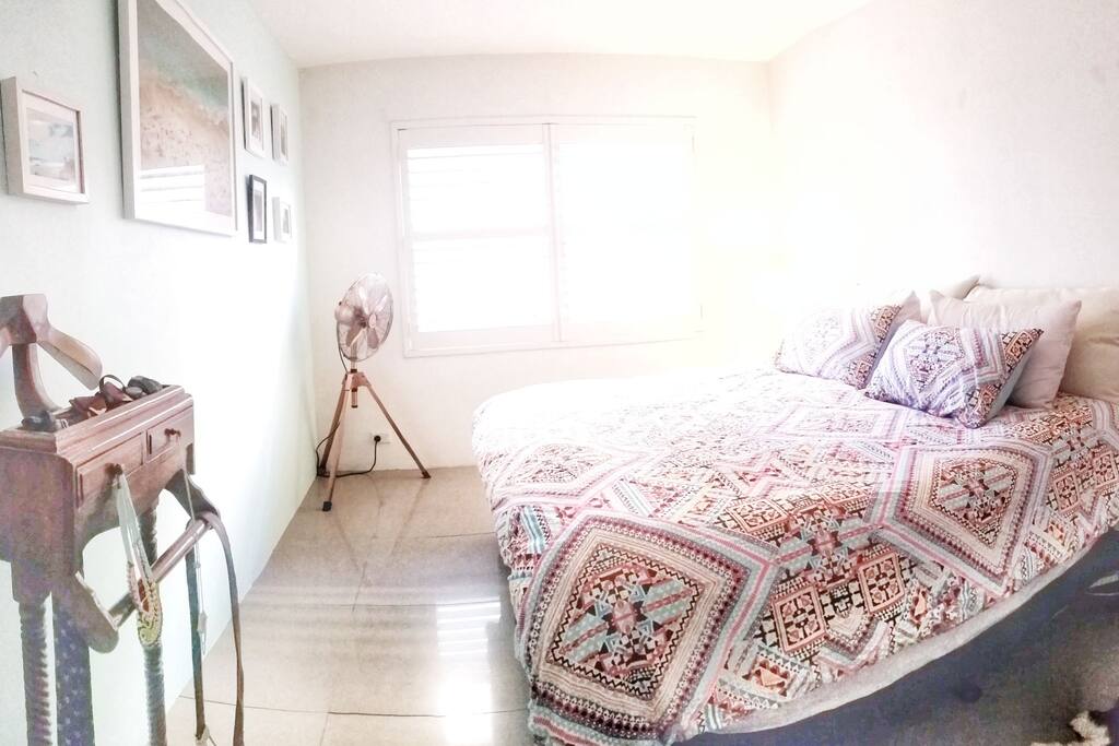 A luxurious king sized bed in one of the bedrooms