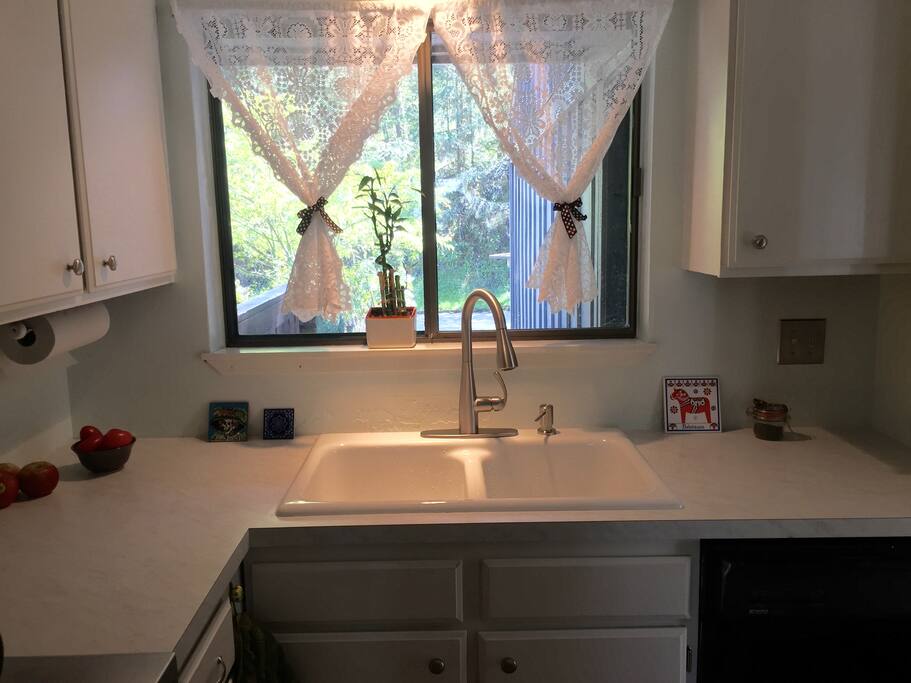Kitchen with new countertop, sink, and faucet