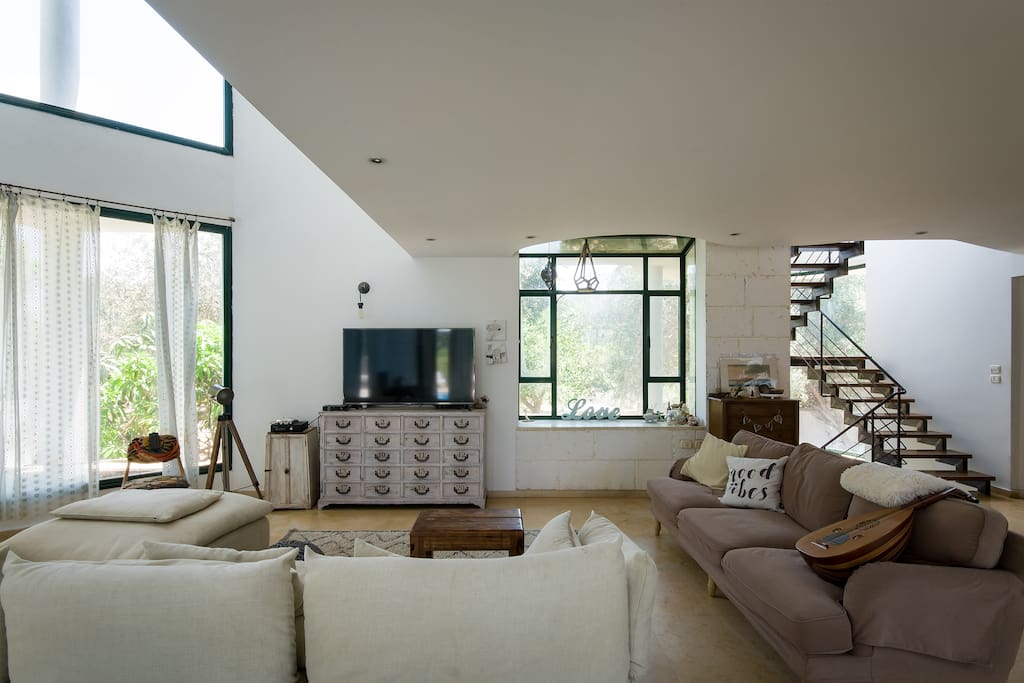 Living room with tv and forest view