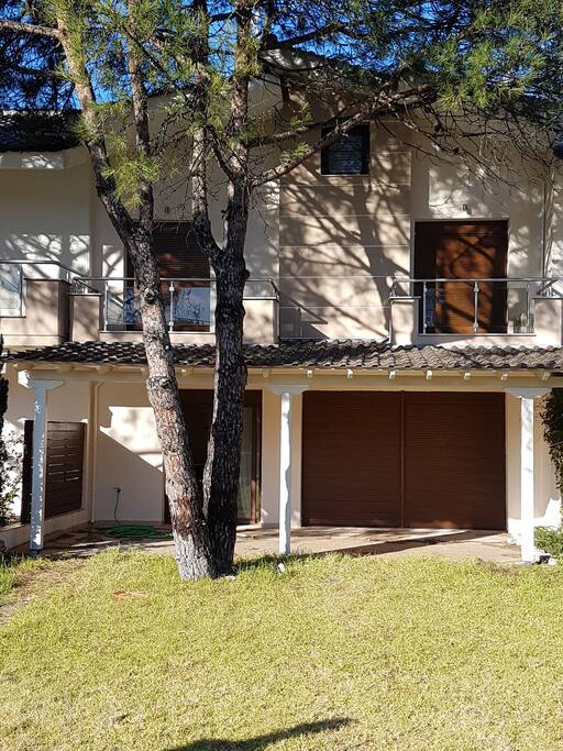 Front side with bedroom balconies on 1st floor