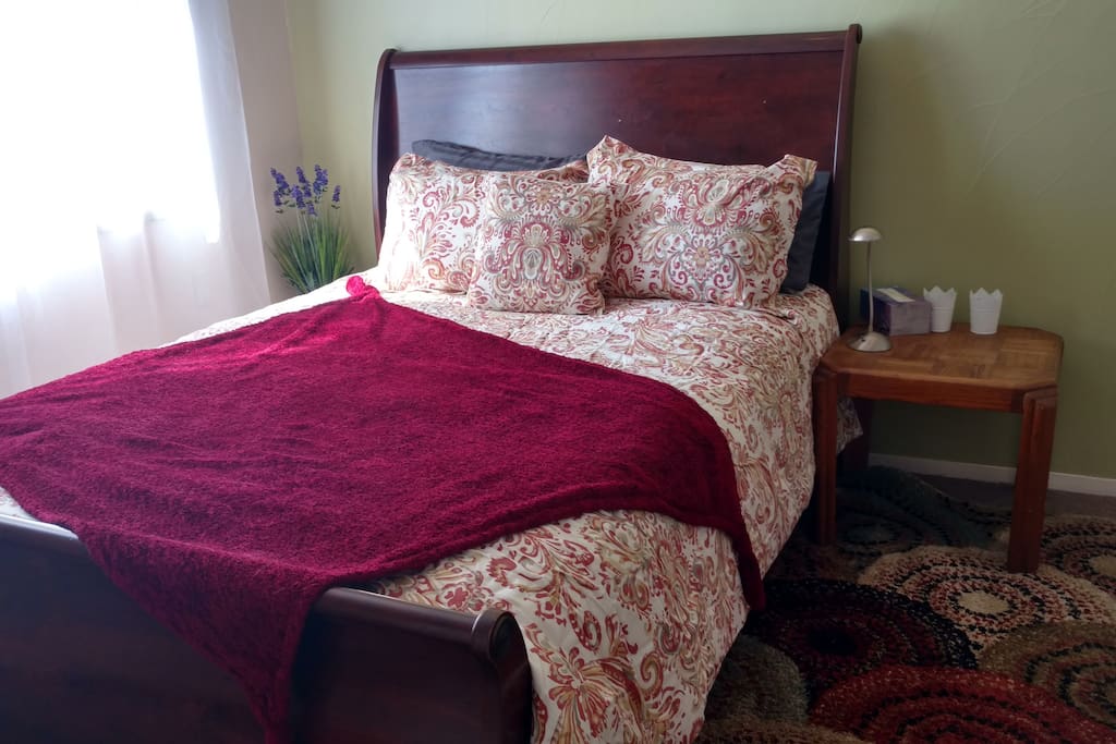 The room features luxury bedding.