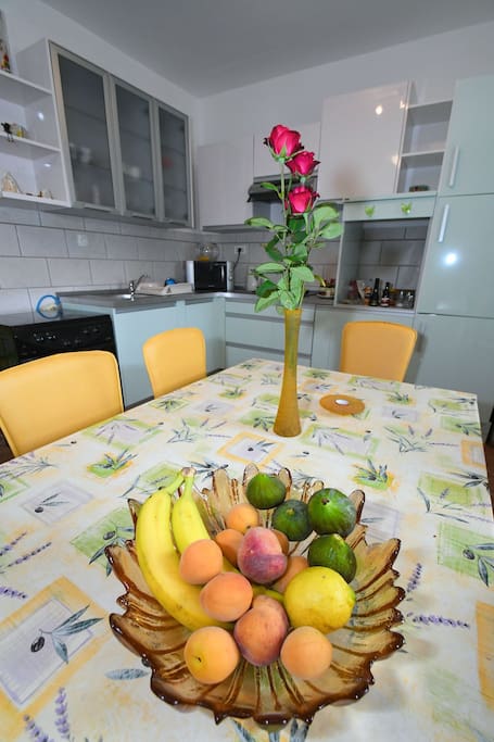 Full equipped kitchen with refrigerator, stove, kettle, microwave