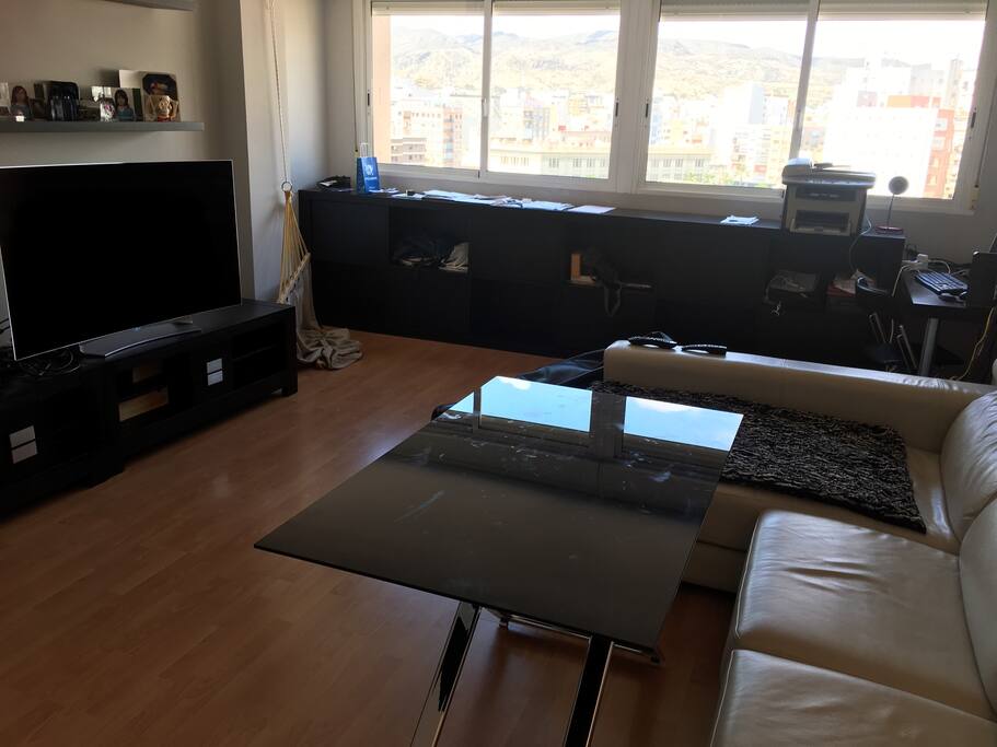 LIVING ROOM WITH A MASSIVE 55' CURVE TV...