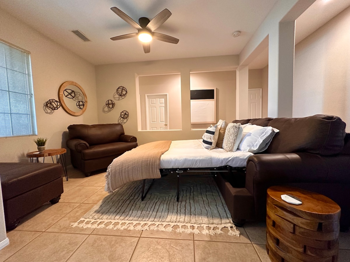 Full size couch converts into a queen sleeper. Please note, this is not a private room. 