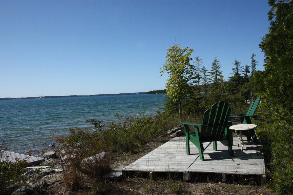 The shore is a lovely spot to spend any part of the day. Small deck, chairs and a 50 foot dock. Mushroom mooring for your sailboat. Wooded. Private. Gorgeous.