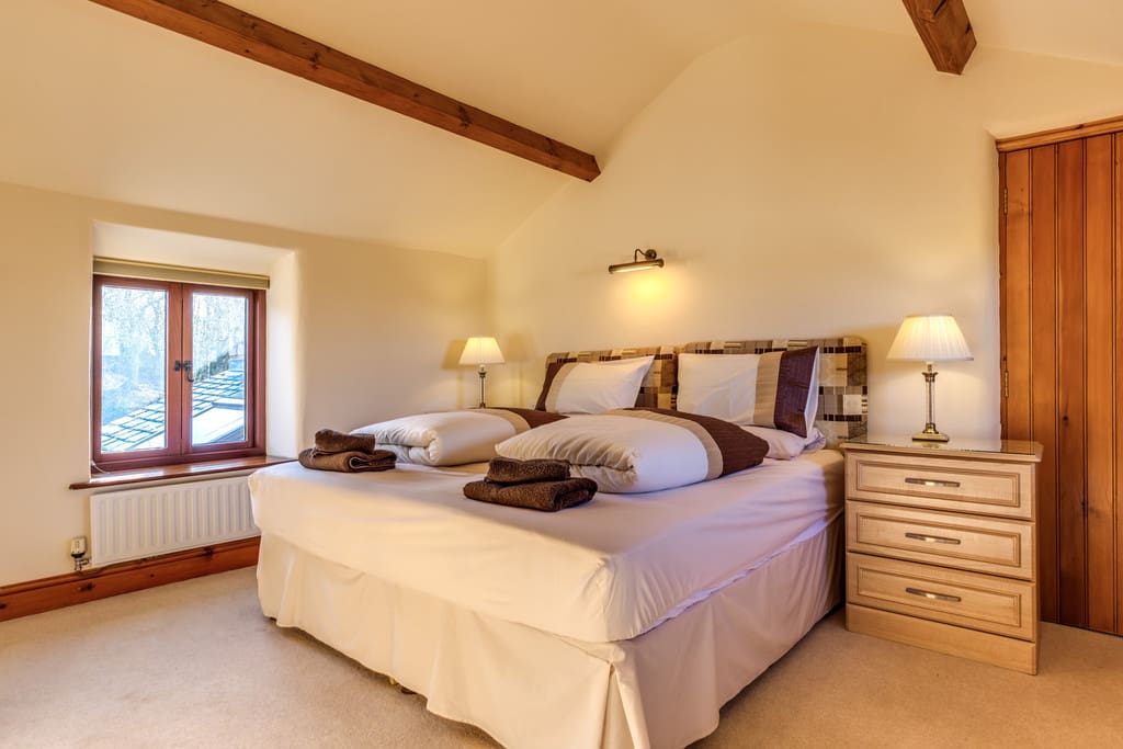 Master bedroom showing bedside cabinates