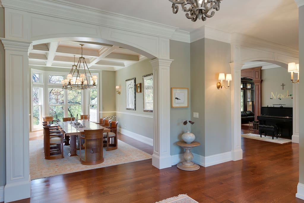 Foyer opens into formal dining space, informal dining space, and kitchen.