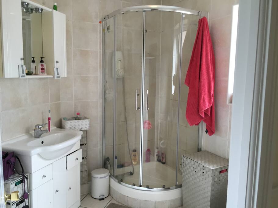 Upstairs bathroom with shower shared between two others.