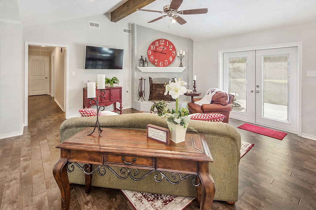 Large wall mounted TV for viewing by all in entire family area.