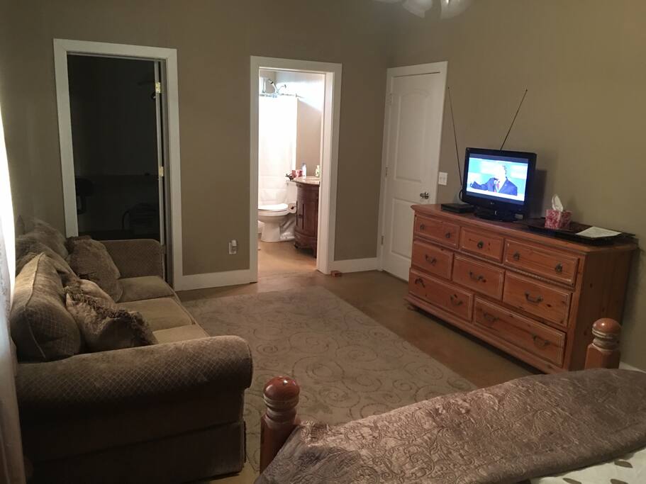 Living area in bedroom allows you to kick your feet up and relax