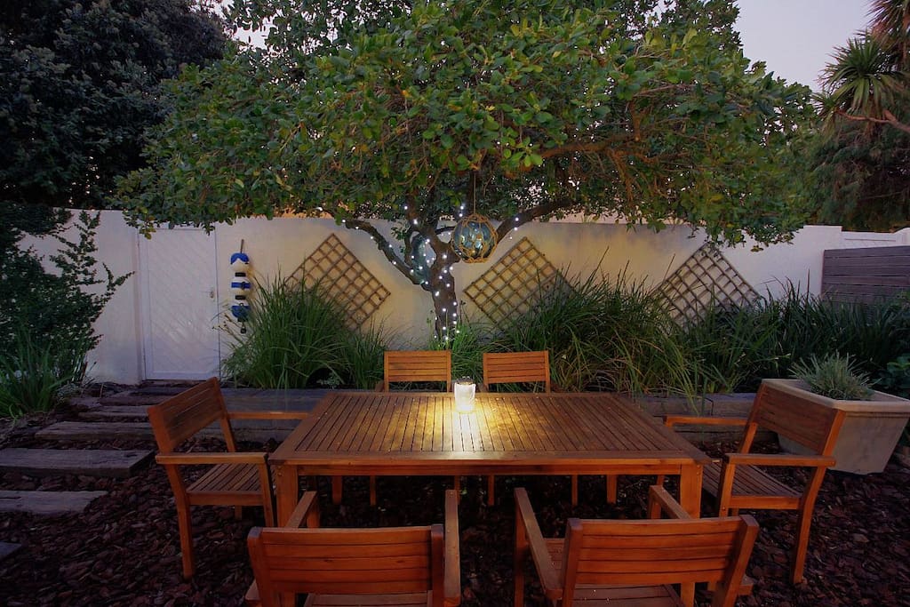 Relax in our garden area. The gate on the left of the image leads to the beach.