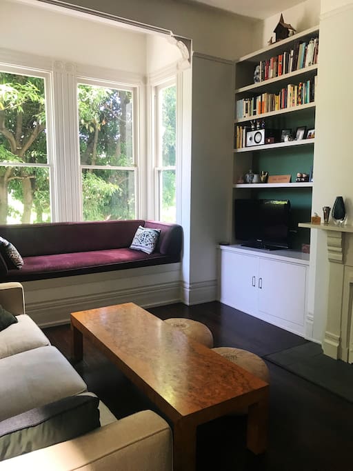 Spacious living room with sunny window seat. TV with Roku and access to Netflix & Amazon.