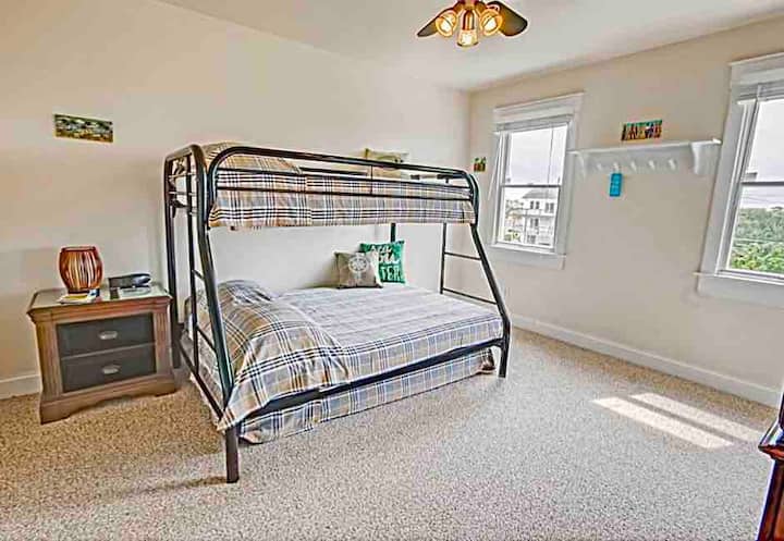 Bunk Room. Single over double over single pull out.  Direct access to shared bathroom which is between the Bunk bedroom and the Twin bedroom. Access  to third level deck from this room. Please Note you will need to bring your own sheets and towels.