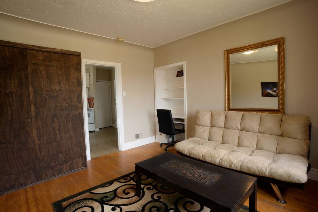 The murphy bed folds up so you can fully utilize the space in this bachelor suite! Also note the desk space available if you need to het some work done.