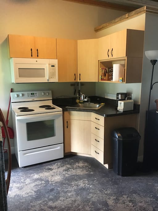 Full kitchen with microwave , oven , toaster , coffee pot .
Dishes and pots and pans for the people who stay and want to cook .