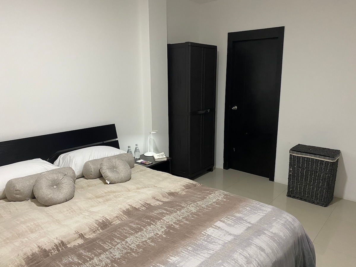 Master bedroom has AC, private bathroom, TV ( Netflix- YouTube) and a romantic mini patio to have a wine with your partner.