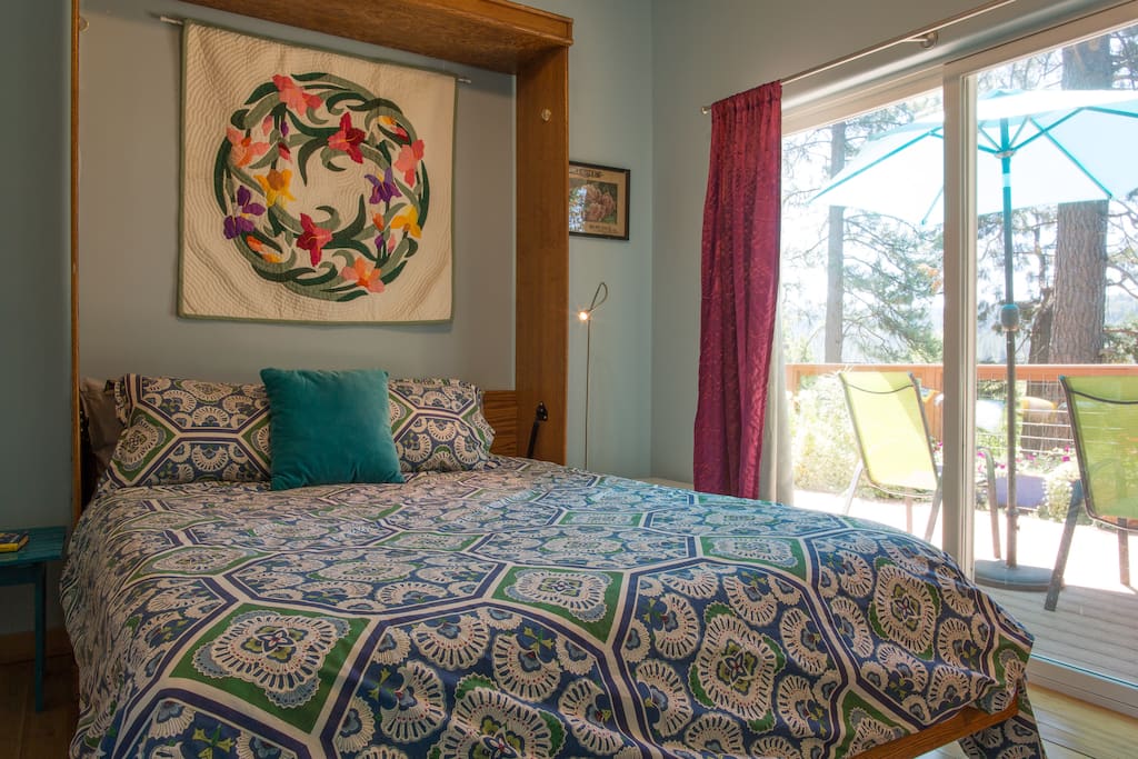 Queen bed, private, opens out to deck. Beautiful views from bedroom.