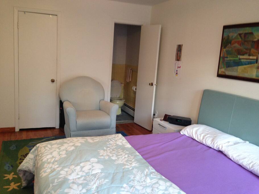 Main room has a queen bed and a half bathroom