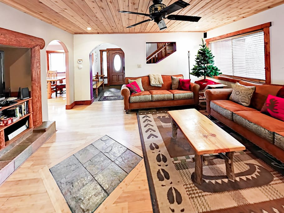 With all the charm of a rustic-chic log cabin, the living room has abundant seating for the whole family.