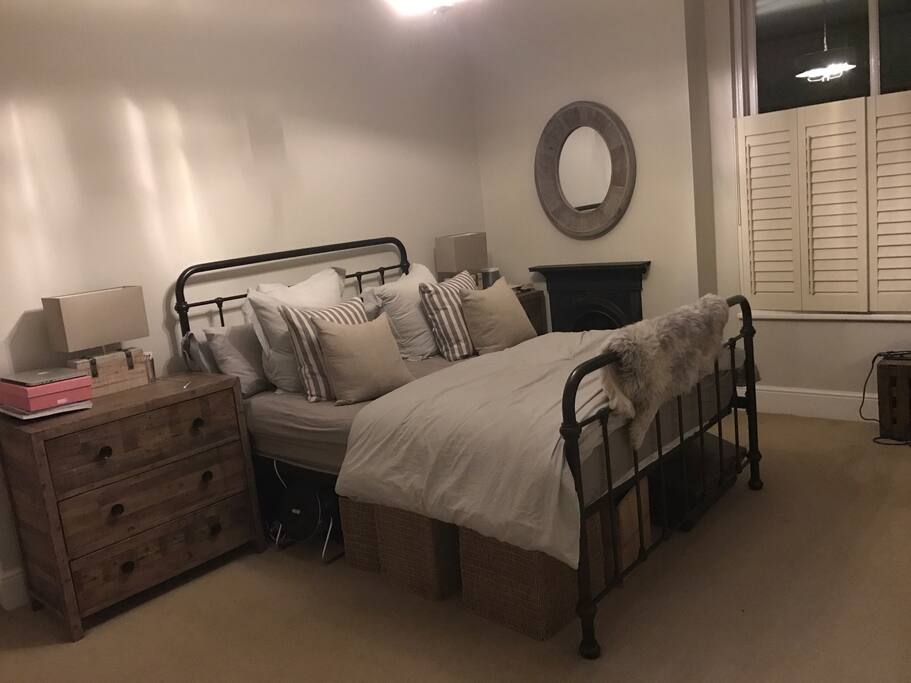 Master bedroom with ensuite, king size bed, original fireplace (non operational), dressing table and armchair