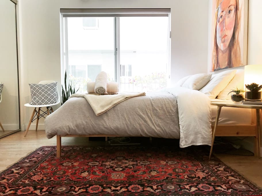 Private bedroom comes complete with a tempurpedic mattress topper and a gorgeous hand woven Parisian rug! The light in this room is magic!