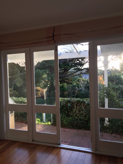 Bedroom has french doors that lead out to the enclosed back yard