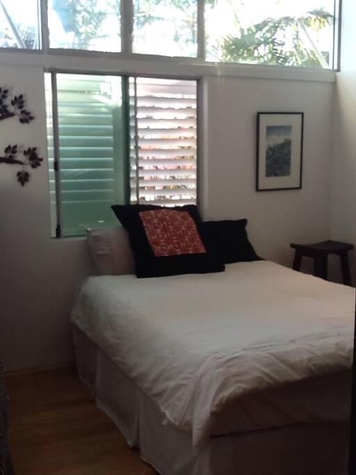 The room with queen bed and the sound of the ocean