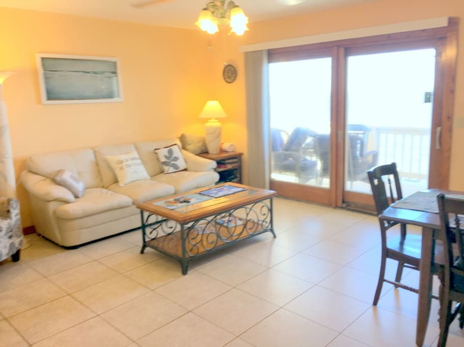 Living room, 8 foot sliding glass door to deck overlooking water, queen sleeper couch