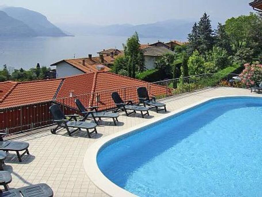 Pool with a stunning view of Lake Como. Sun beds available to all guests. Direct access from our property to the right.