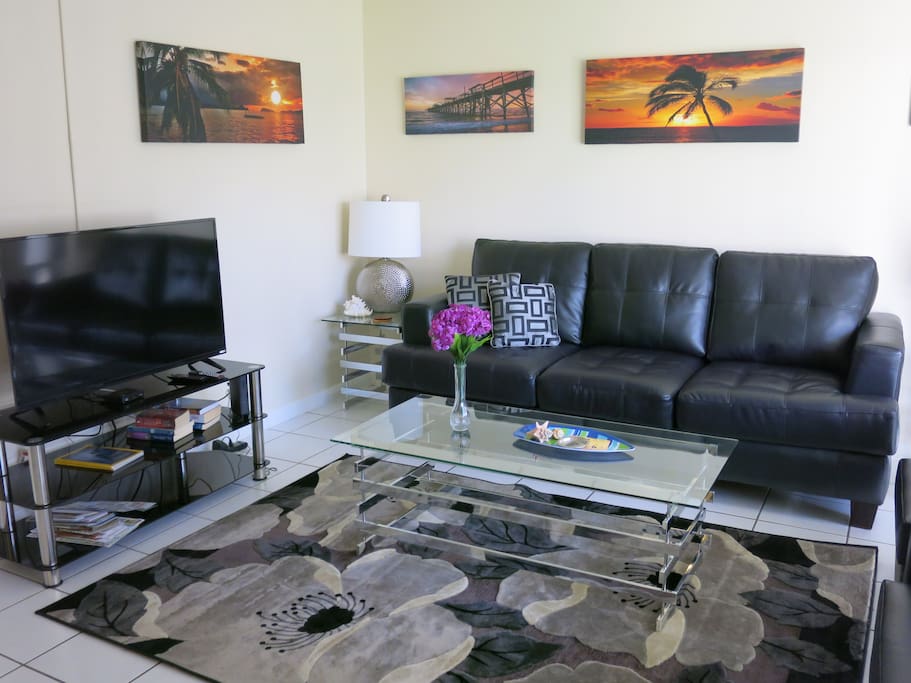 LIVING ROOM IS FURNISHED WITH CONTEMPORARY FURNITURE