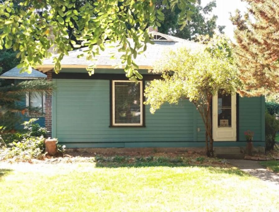 The historic Fischer House ~ the studio is along the left side (you can see it peeking through). The house is newly painted in a color called "refuge" ~ we're hoping this is apropos.