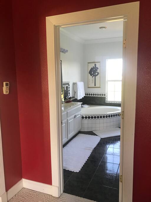 Red Room Jacuzzi bath, with dual sinks and separate shower