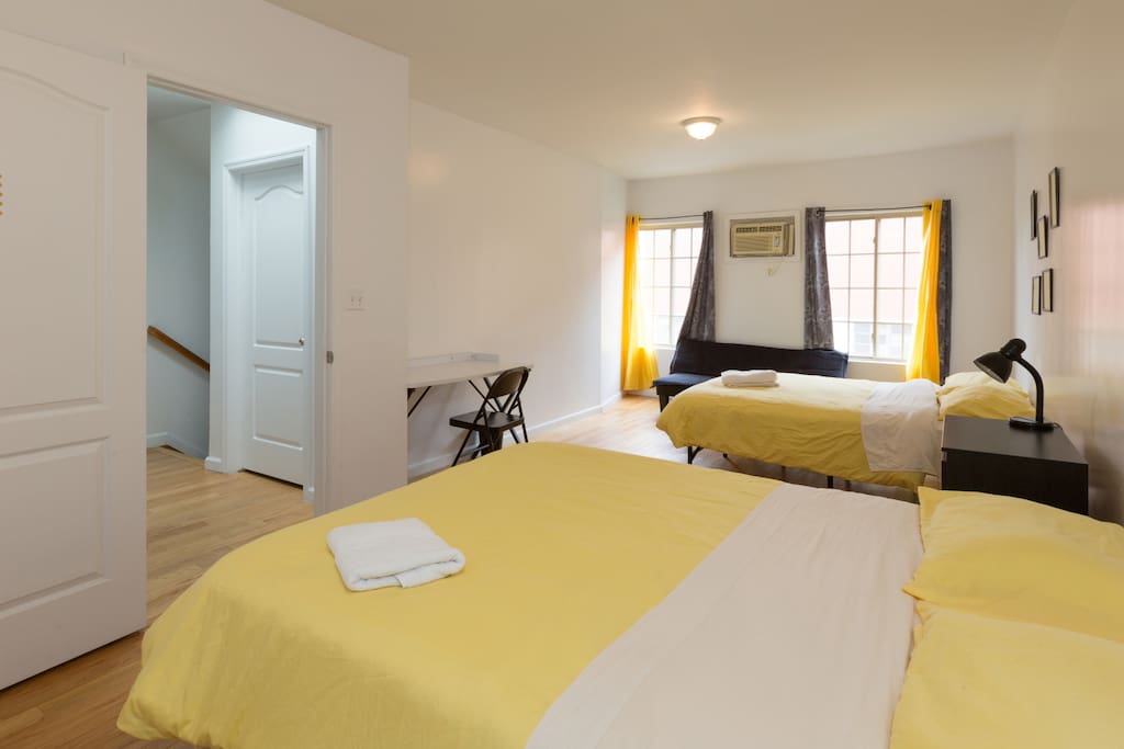 2 large windows in the bedroom.
You can see the Air Conditioner between them, which lets *YOU* control the temperature in your bedroom.
Blackout shades mean you can block out the sun and sleep in late if you want to!