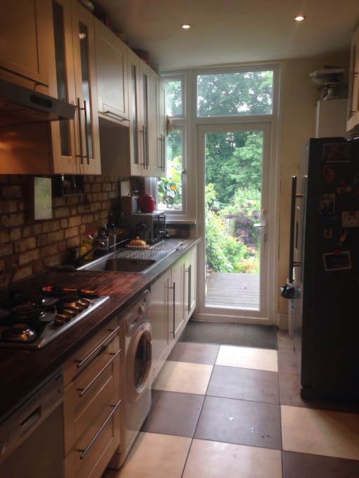 Kitchen with washer dryer.