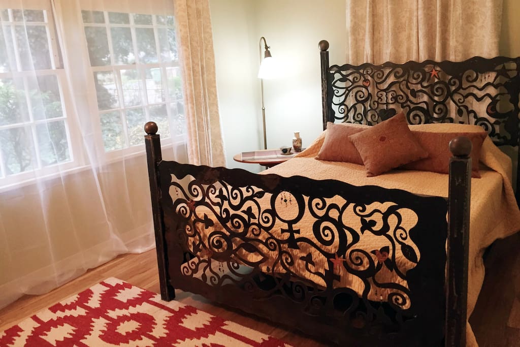 Unique sculptural queen bed features Tempurpedic comfort.