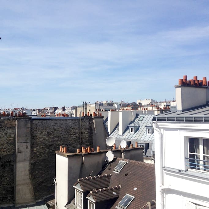 view of the window over the Parisian roofs - vue de la fenêtre